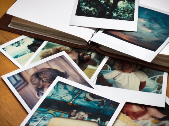 old photos laid out on table