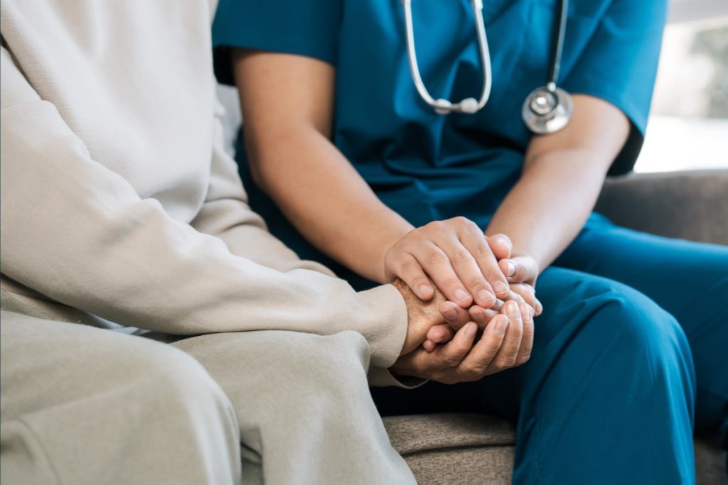 Two people holding hands