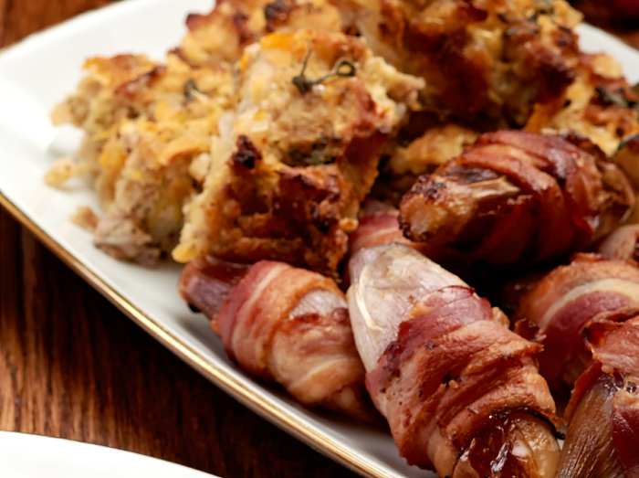 Roasted shallots in bacon blanket 