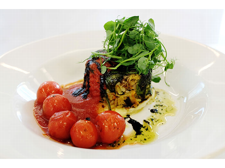 Christopher Bridge - Cumberland herb pudding, nettle scented dauphinoise potatoes, cherry tomato compote, fresh pesto and balsamic syrup.