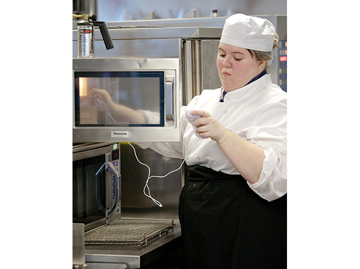 Kathryn checking food temperature